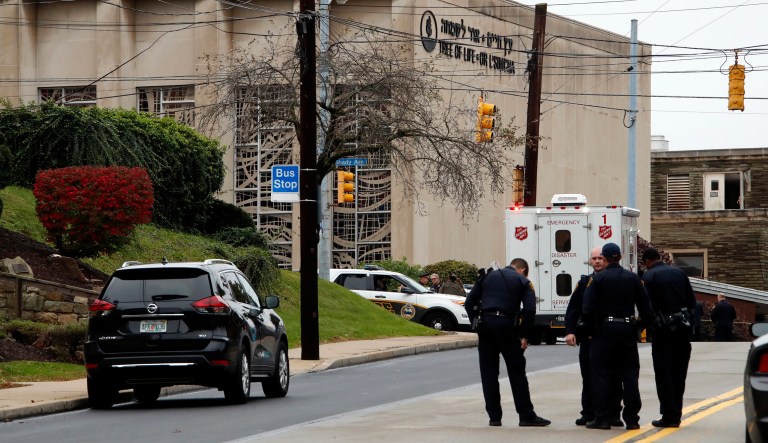 First responders stand outside the Tree of Life Synagogue in Pittsburgh, where a shooter opened fire Saturday, Oct. 27, 2018, injuring multiple people, including police officers.