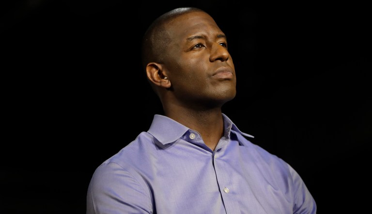 Democratic gubernatorial candidate Andrew Gillum listens during a campaign rally attended by former President Barack Obama, Friday, Nov. 2, 2018, in Miami.