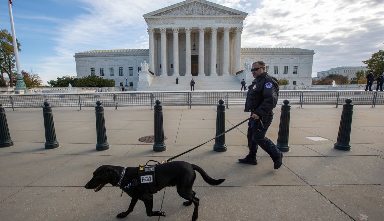 Police do a security sweep at the Supreme Court before the arrival of President Donald Trump to attend a ceremony for new Associate Justice Brett Kavanaugh, in Washington, Thursday, Nov. 8, 2018.