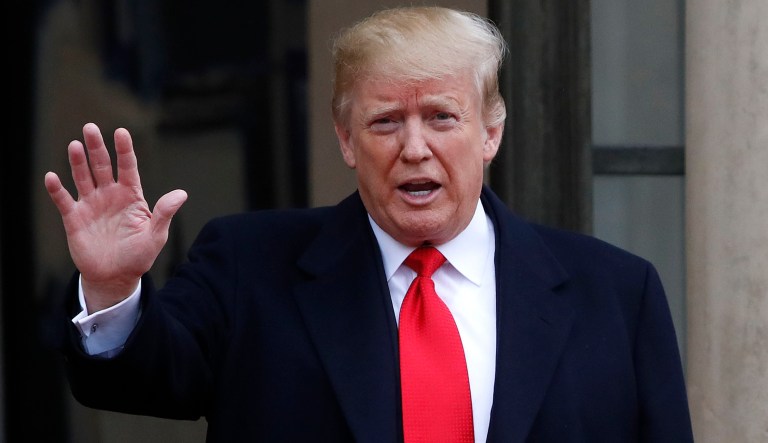 President Donald Trump waves as he arrives at the Elysee Palace in Paris for a lunch after participating in a World War I Commemoration Ceremony, Sunday Nov. 11, 2018. International leaders are taking place in a ceremony in Paris on Sunday to mark the 100th anniversary of the Armistice that ended World War I. 
