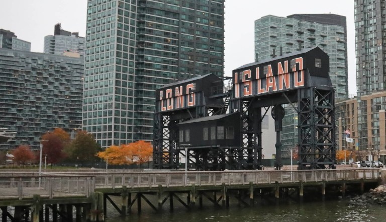 A former dock facility is shown with old transfer bridges, with "Long Island" painted in large letters at Gantry State Park in the Long Island City section of Queens, N.Y.