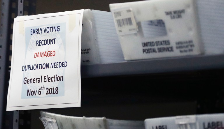 An early voting recount damaged duplications needed, bin stir on a shelf at the Broward County Supervisor of Elections office during a recount on Tuesday, Nov. 13, 2018, in Lauderhill, Fla.