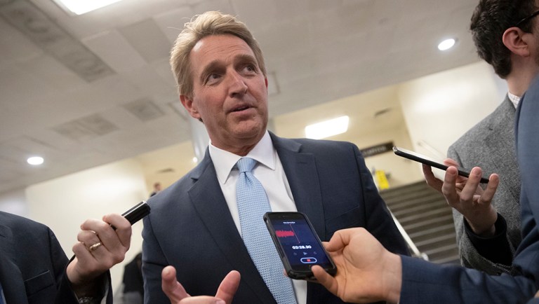 Sen. Jeff Flake, R-Ariz., speaks with reporters before he tries to bring up the legislation to protect special counsel Robert Mueller.