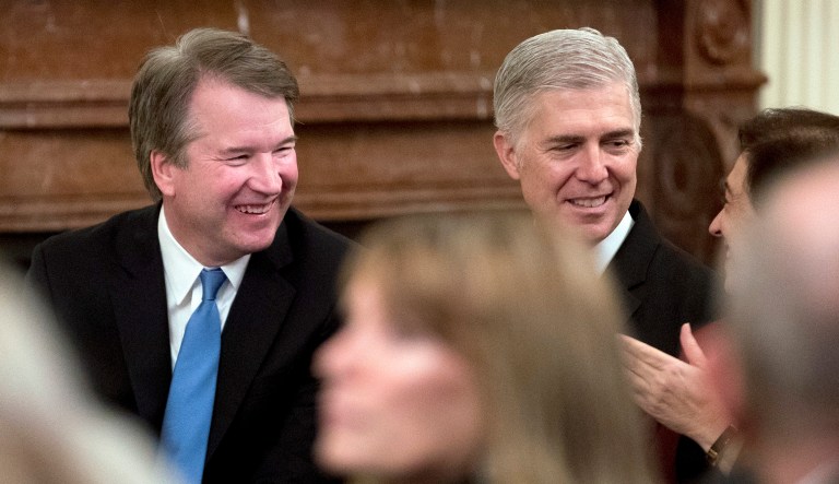 From left, Supreme Court Associate Justices Brett Kavanaugh, Neil Gorsuch, and Elena Kagan speak in the audience before President Trump arrives for a Medal of Freedom ceremony in the East Room of the White House in Washington, Friday, Nov. 16, 2018. 