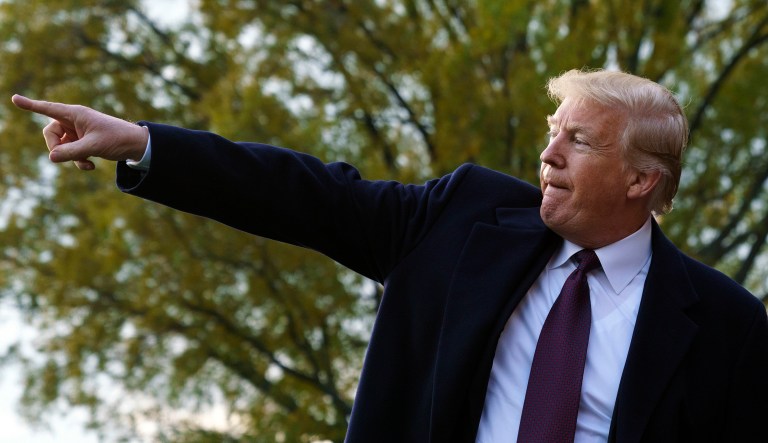 President Trump points as he greets supporters before boarding Marine One on the South Lawn of the White House in Washington, Tuesday, Nov. 20, 2018.