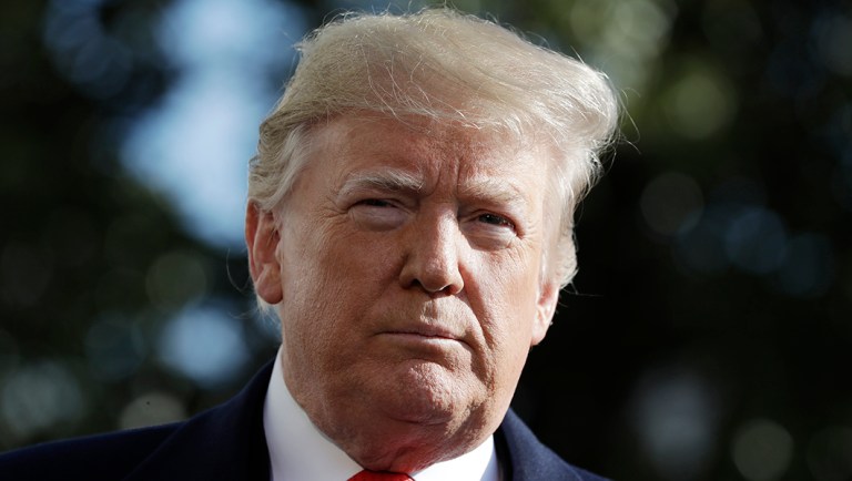 President Trump talks with reporters before traveling to the G20 Summit in Buenos Aires.