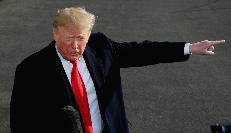 President Trump speaks to reporters on the South Lawn before leaving the White House in D.C.