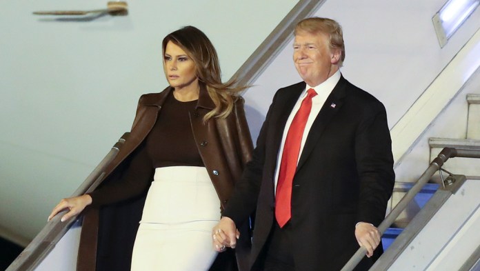 President Trump and first lady Melania Trump walk from Air Force One.