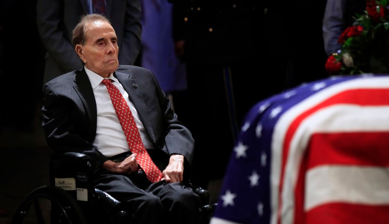 Former Sen. Bob Dole pays his last respects to former President George H.W. Bush as he lies in state at the U.S. Capitol in D.C. on Tuesday.