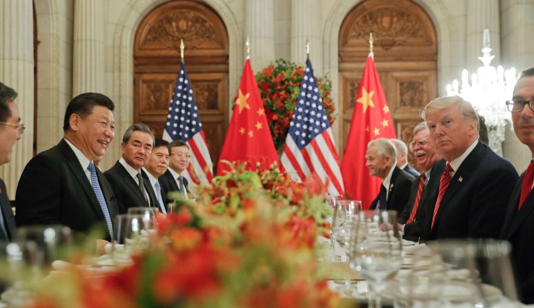 In this Dec. 1, 2018, photo, President Donald Trump, second from right, meets with China's President Xi Jinping, second from left, during their bilateral meeting at the G20 Summit, in Buenos Aires, Argentina.