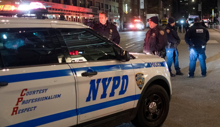 New York City police officers stand by near the Time Warner Center in New York on Dec. 6, 2018.
