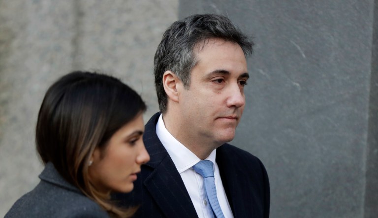 Michael Cohen, right, President Donald Trump's former lawyer, arrives at federal court for his sentencing for dodging taxes, lying to Congress and violating campaign finance laws in New York on Wednesday, Dec. 12, 2018.