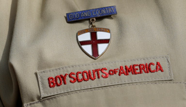 In this Feb. 4, 2013 photo, shows a close up detail of a Boy Scout uniform worn during a news conference in front of the Boy Scouts of America headquarters in Irving, Texas. 