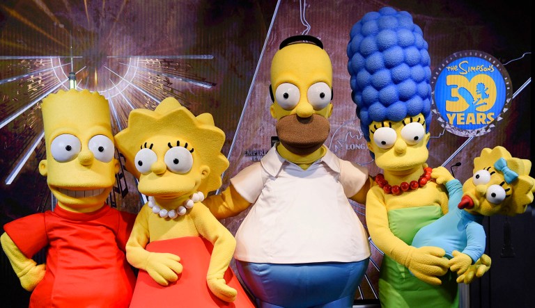 Costumed characters Lisa Simpson, left, Homer Simpson, Marge Simpson, Maggie Simpson and Bart Simpson participate in Fox's "The Simpsons" 30th anniversary celebration at the Empire State Building on Monday, Dec. 17, 2018, in New York. 