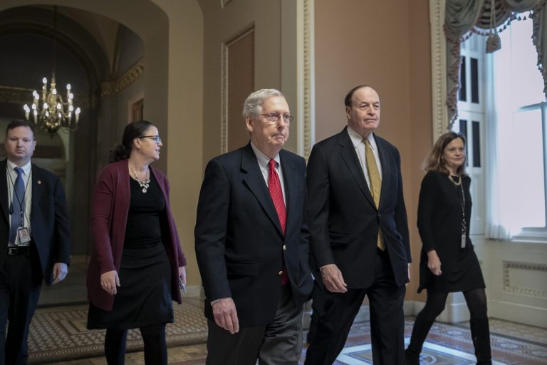En route to a meeting at the White House, Senate Majority Leader Mitch McConnell, R-Ky., left, walks with Sen. Richard C. Shelby, R-Ala., chairman of the Senate Appropriations Committee, as work continues prior to a Friday night funding deadline to avoid a partial government shutdown, in Washington, Friday, Dec. 21, 2018. Trump is imploring McConnell to change the Senate's rules in order to pass the spending bill with money for a border wall.