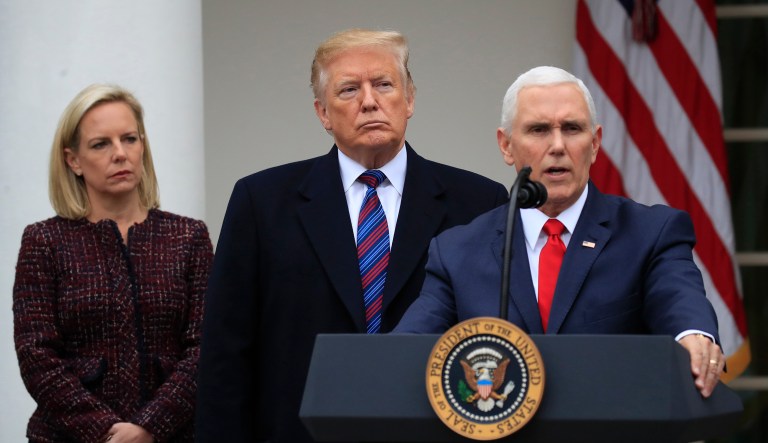 President Trump joined by Homeland Security Secretary Kirstjen Nielsen, left, listens to Vice President Mike Pence speaks in the Rose Garden of the White House in Washington after a meeting with Congressional leaders on border security as the government shutdown continues Friday, Jan. 4, 2019, in Washington.