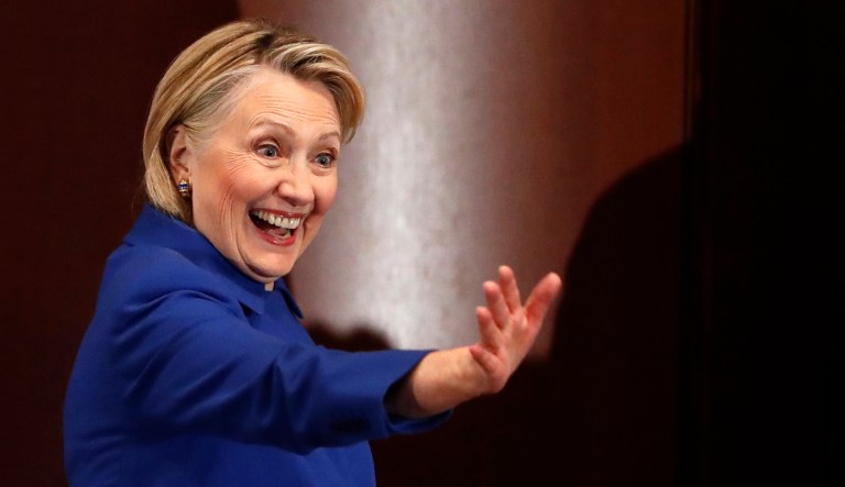 Former Secretary of State Hillary Clinton waves to well-wishers following an appearance at Barnard College.