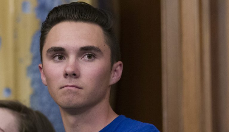 David Hogg, who survived the Stoneman Douglas High School shooting, stands during a news conference to announce the introduction of bipartisan legislation to expand background checks for sales and transfers of firearms, on Capitol Hill, Tuesday, Jan. 8, 2019 in Washington. 