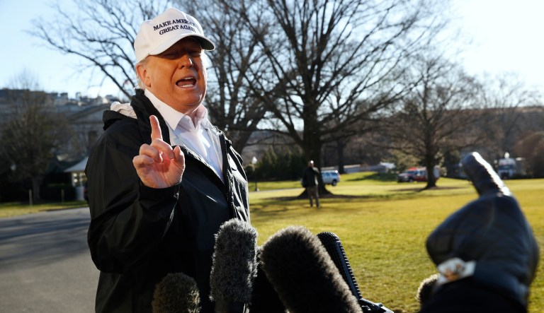 President Trump gestures as a reporter asks a question, as he speaks to the media on the South Lawn of the White House, Thursday Jan. 10, 2019, in Washington, en route for a trip to the border in Texas as the government shutdown continues.