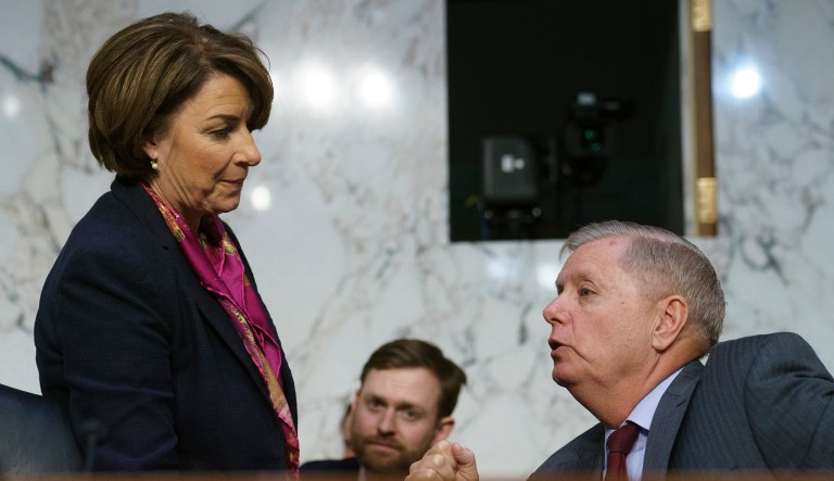 Sens. Amy Klobuchar and Lindsey Graham are seen.