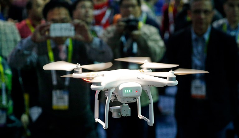 A drone hovers at the DJI booth during CES International in Las Vegas.