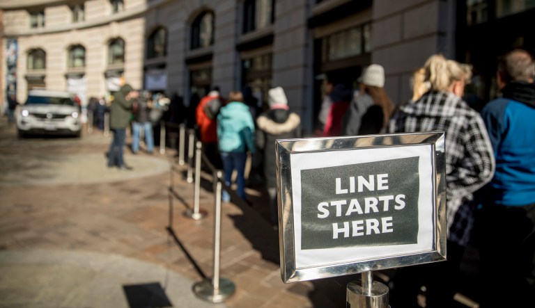 Furloughed workers wait in line to receive food and supplies from World Central Kitchen, the not-for-profit organization started by Chef Jose Andres in Washington, D.C.