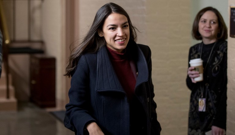 Rep. Alexandria Ocasio-Cortez, D-N.Y., arrives for a House Democratic Caucus meeting on Capitol Hill in Washington, Wednesday, Jan. 23, 2019.