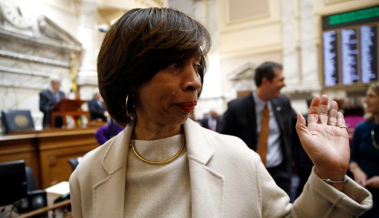 Baltimore Mayor Catherine Pugh walks on the Maryland House of Delegates chamber floor before Gov. Larry Hogan's annual State of the State address to a joint session of the legislature in Annapolis, Md.