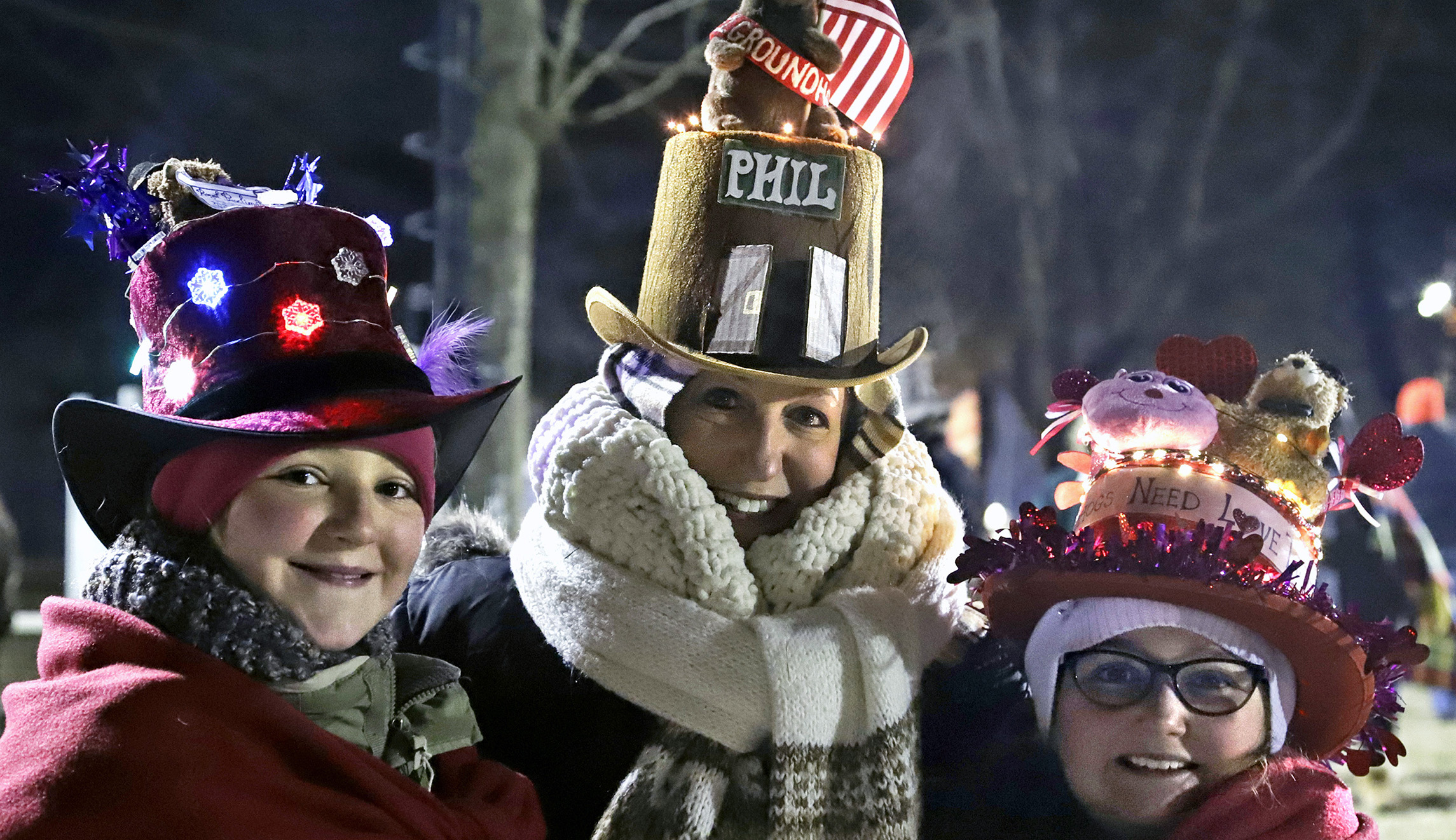 Lisa Gibson, center, and her daughters Josie, left, and AneGiguere of Pittsburgh, arrive early to celebrate the 133rd Groundhog Day on Gobbler's Knob in Punxsutawney, Pa., on Saturday.