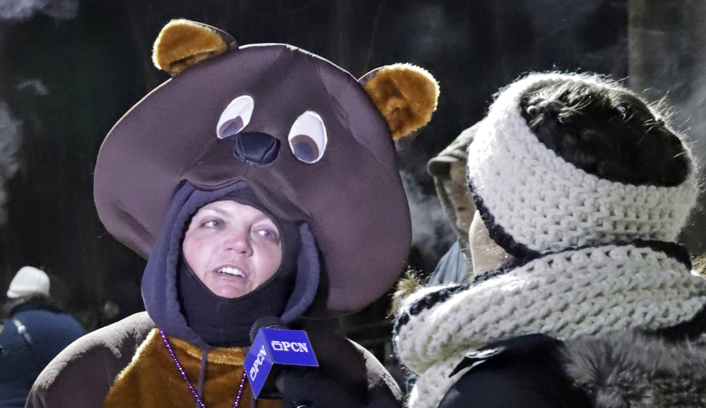 Katie Wolf of New Cumberland, Pa., center, wearing a groundhog costume is interviewed as she arrives for the 133rd Groundhog Day celebration on Gobbler's Knob in Punxsutawney, Pa., on Saturday.
