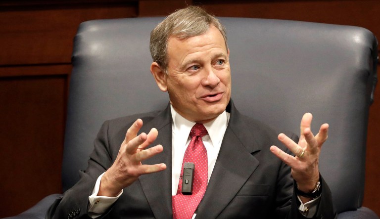 Supreme Court Chief Justice John Roberts answers questions during an event.