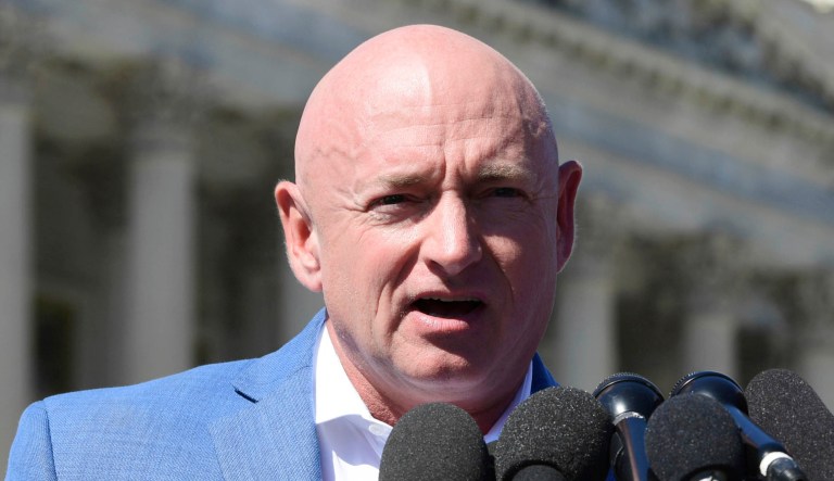 Mark Kelly, an ex-astronaut and the husband of former Rep. Gabrielle Giffords, D-Ariz., speaks on Capitol Hill.