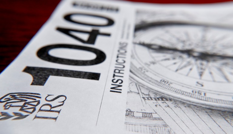 This photo made on Wednesday, Feb. 13, 2019, in Zelienople, Pa., shows 1040 tax forms instructions printed from the Internal Revenue Service web page that are used for 2018 U.S. federal tax returns. 