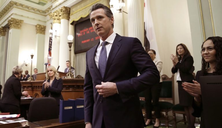 In this Tuesday, Feb. 12, 2019 photo, California Gov. Gavin Newsom receives applause after delivering his first state of the state address to a joint session of the legislature at the Capitol in Sacramento, Calif.