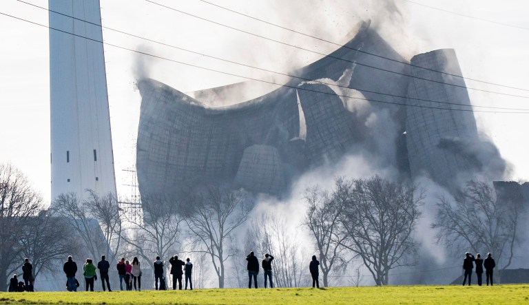 The cooling tower of the former Knepper power station collapses during the blasting of the former coal-fired power station in Dortmund, Germany.