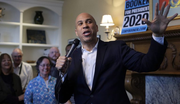 U.S. Sen. Cory Booker, D-N.J., addresses a crowd during a campaign stop Sunday, Feb. 17, 2019, at a home, in Manchester, N.H. 