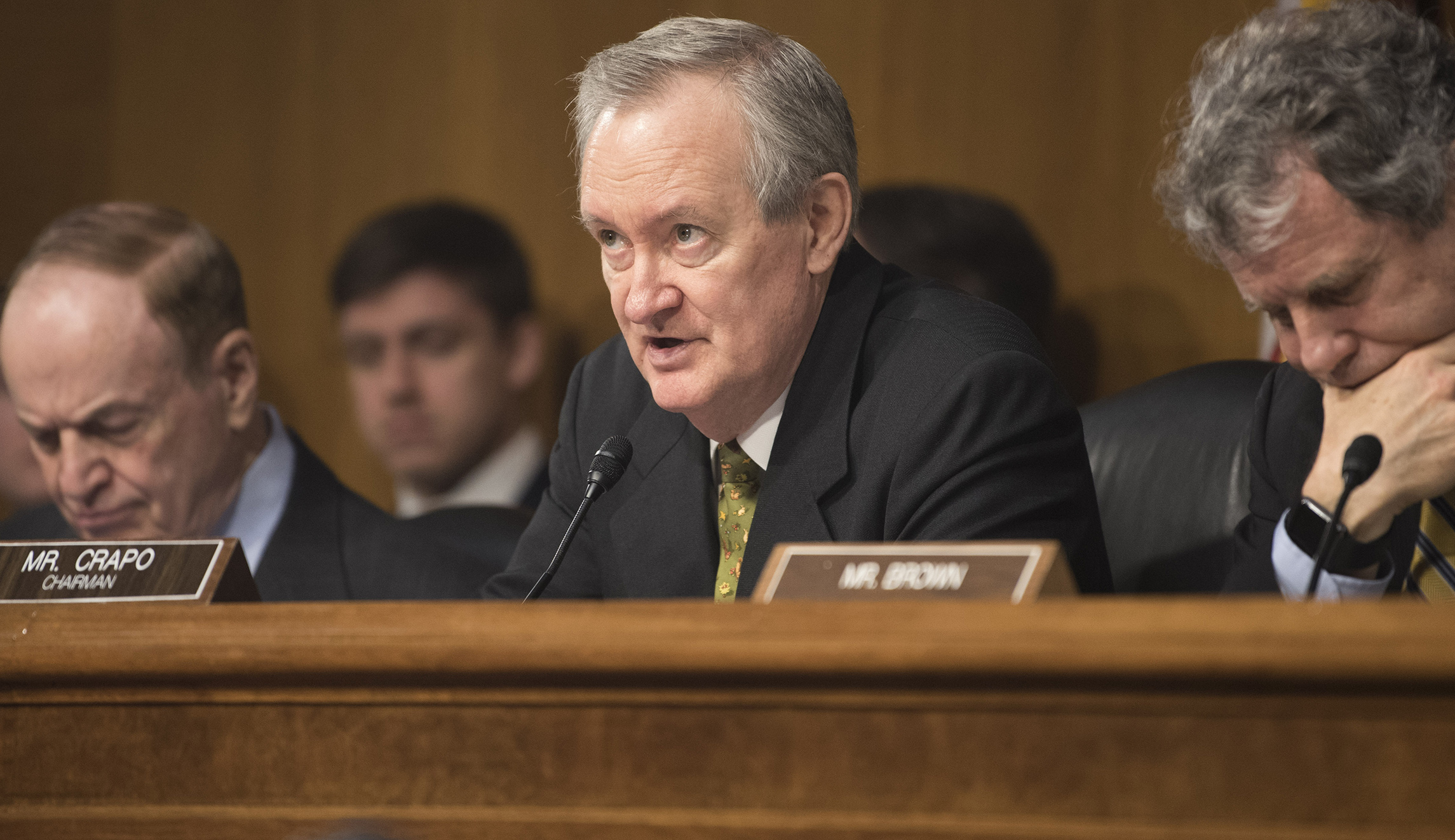 Mike Crapo warns big banks against caving to progressives on guns