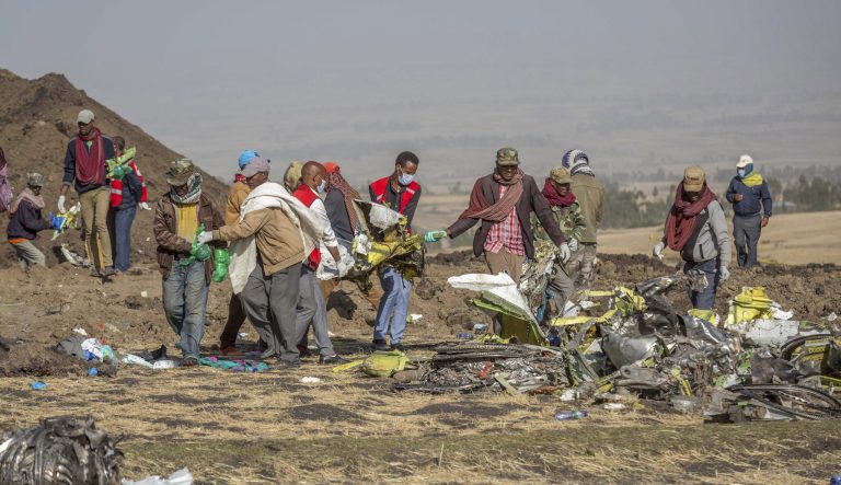 Rescuers work at the scene of an Ethiopian Airlines flight crash near Bishoftu, or Debre Zeit, south of Addis Ababa,  Ethiopia, Monday, March 11, 2019. 