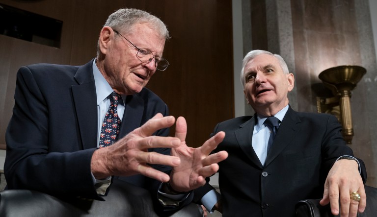 Senate Armed Services Committee Chairman Jim Inhofe, R-Okla., left, and Ranking Member Jack Reed, D-R.I., confer before a hearing on the Pentagon budget, on Capitol Hill in Washington, Thursday, March 14, 2019. 