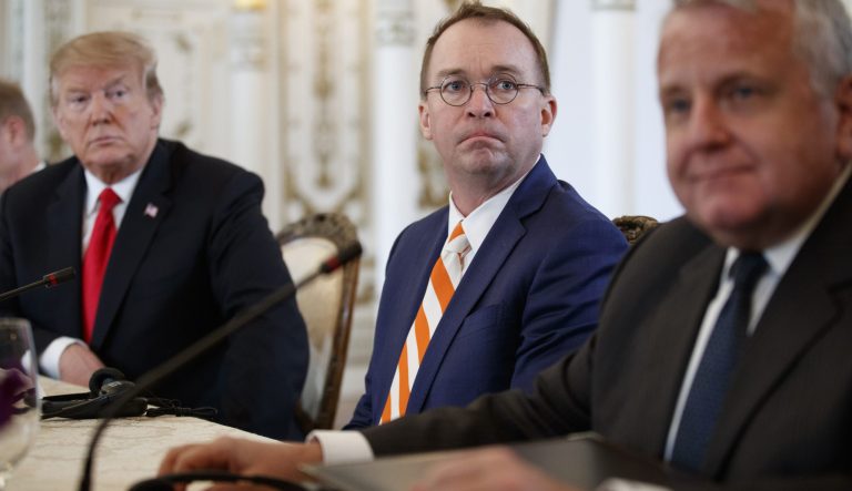 From left, President Donald Trump and acting White House chief of staff Mick Mulvaney, and Deputy Secretary of State John Sullivan, sit together during a meeting at Mar-A Lago, Friday, March 22, 2019, in Palm Beach, Fla. 