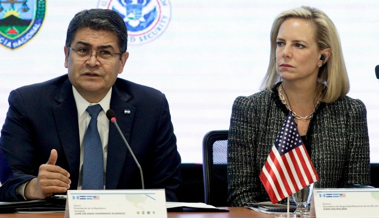 Honduran President, left, speaks as Secretary of Homeland Security Kirstjen Nielsen listens during a meeting in Tegucigalpa, Honduras.