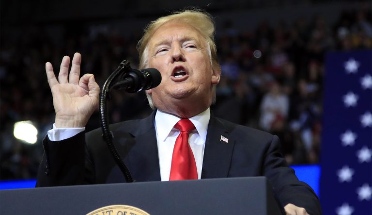 In this March 28, 2019 photo, President Donald Trump speaks at a campaign rally in Grand Rapids, Mich. After losing in Congress, Trump is counting on the courts to kill off "Obamacare." But some cases are going against him, and time is not on his side as he tries to score a big win for his re-election campaign. Two federal judges in Washington, D.C., this past week blocked Trump's Medicaid work requirements and small business health plans.  