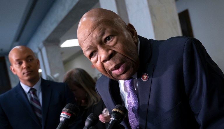 House Oversight and Reform Committee Chairman Elijah Cummings, D-Md., (right) speaks to reporters.