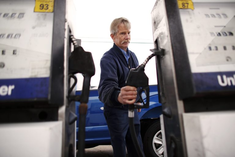 In this Tuesday, March 26, 2019 photo, Eddie Cartwright finishes gassing up a pick-up in South Mills, N.C.