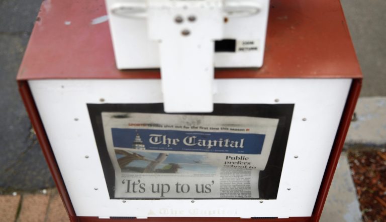 This April 15, 2019 photo shows a copy of the day's Capital Gazette newspaper in a newsstand in Annapolis, Md. 