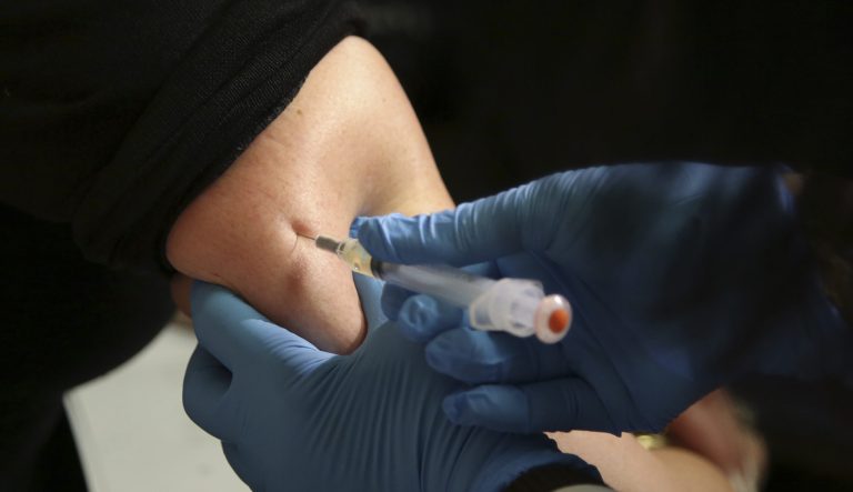A woman receives a measles, mumps and rubella vaccine at the Rockland County Health Department in Pomona, N.Y.