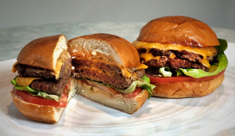 An Original Impossible Burger (left) and a Cali Burger, from Umami Burger, are shown in this photo.