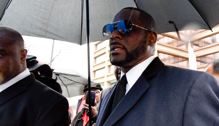 Musician R. Kelly, right, leaves the Leighton Criminal Court building after a hearing in his sex-abuse case, Tuesday, May 7, 2019, in Chicago.
