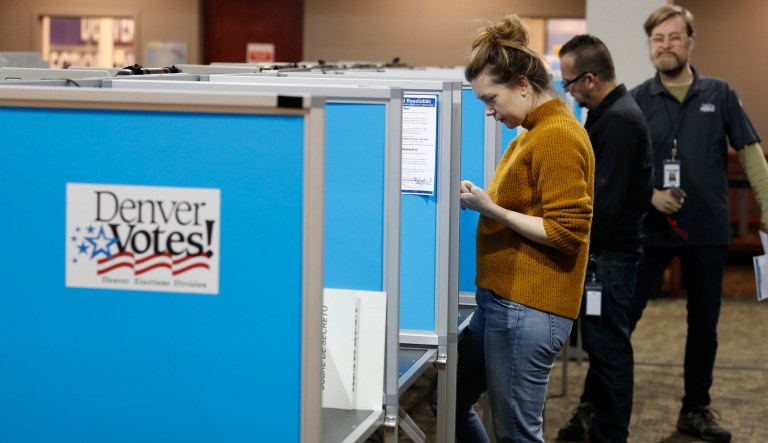 Voters fill out their ballots at the Denver Elections Division Tuesday, May 7, 2019, in Denver. Voters could make Denver the first U.S. city to decriminalize the use of psilocybin, the psychoactive substance in "magic mushrooms" if the measure passes.