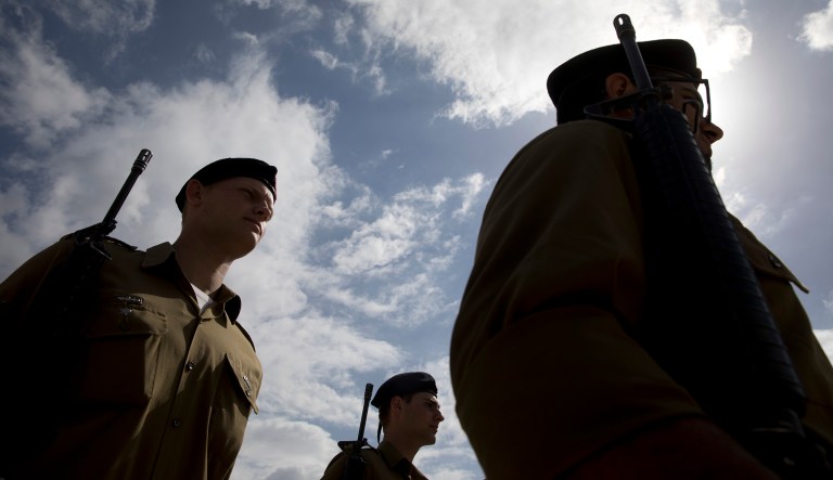 Israeli honor guards march in formation during rehearsal just before a ceremony marking the annual Memorial Day to remember fallen soldiers and victims of terror, at the Armored Corps memorial site in Latrun, Israel, Wednesday, May 8, 2019. Israel marks the annual Memorial Day in remembrance of soldiers who died in the nation's conflicts.